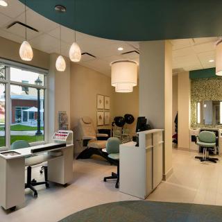 A modern office reception area with stylish furnishings and lighting.