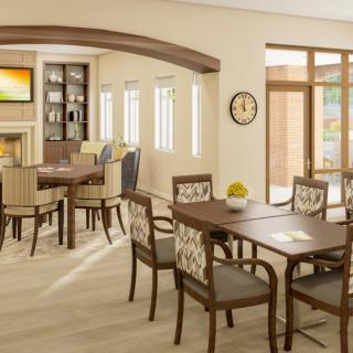 A modern dining area with elegant furnishings, featuring several tables and chairs bathed in natural light.