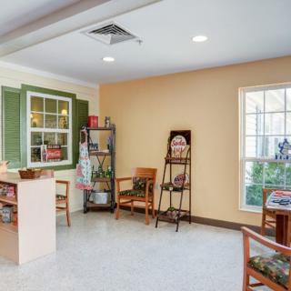 A cozy waiting room with chairs and decor.