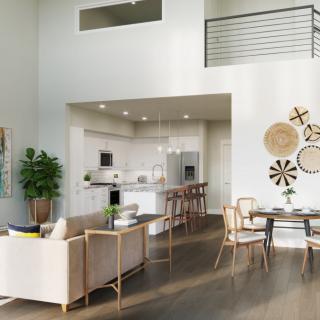 A modern open floor plan with a stylish living room and kitchen area, featuring contemporary furniture and decor.