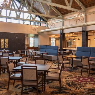 Spacious dining area with elegant decor and ample seating.