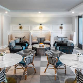 A modern cafe interior with stylish seating and elegant decor.