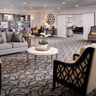 A stylish living room with comfortable seating and elegant decor.