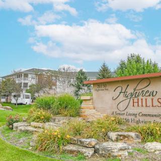 Welcome to Harrison Hills, a serene residential community surrounded by lush landscaping.