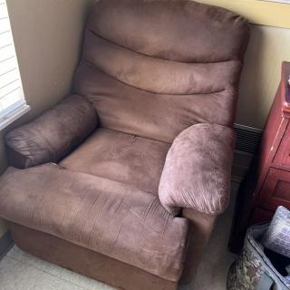 A plush brown recliner placed in a cozy corner of the room.