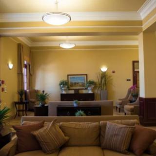 A cozy living room with comfortable seating and warm lighting.