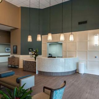 A modern reception area with pendant lights and comfortable seating.