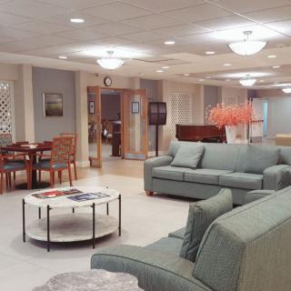 A modern, well-decorated lobby with comfortable seating and ambient lighting.