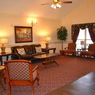 A cozy living room with elegant furniture and warm lighting.