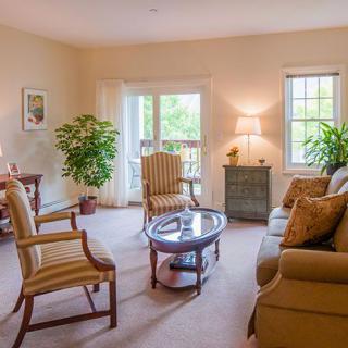 A cozy living room with comfortable seating and natural light.