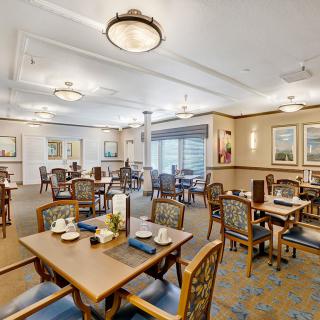 Elegant dining room with neatly arranged tables and classic decor.