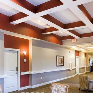 Spacious lobby area with modern ceiling design and comfortable seating.
