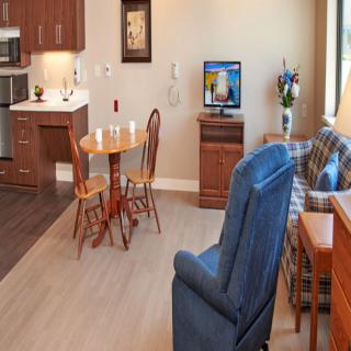 Cozy living space with a small dining area and comfortable seating.