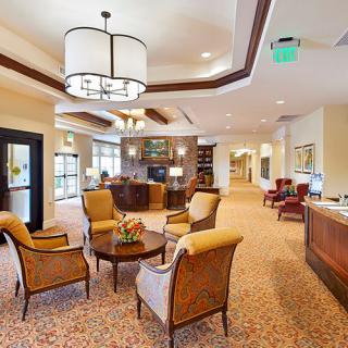 A cozy lobby interior with elegant seating and a reception desk.