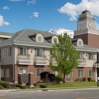 A classic building with a prominent clock tower and clear skies.