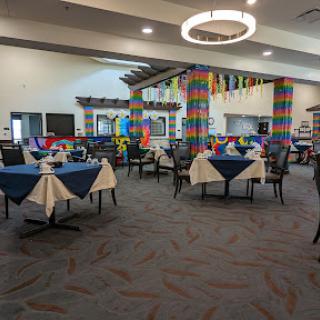 A vibrant restaurant interior featuring colorful decor and neatly arranged tables.