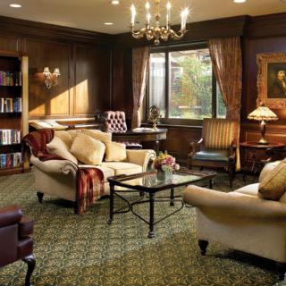 A luxurious living room with elegant furniture and warm lighting.