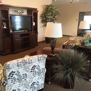 A cozy living room with comfortable seating and a television.