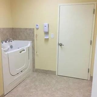 An accessible bathroom featuring a walk-in bathtub designed for ease of use.