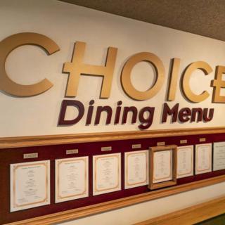 A dining menu display with various meal options, labeled 'CHOICE Dining Menu'.