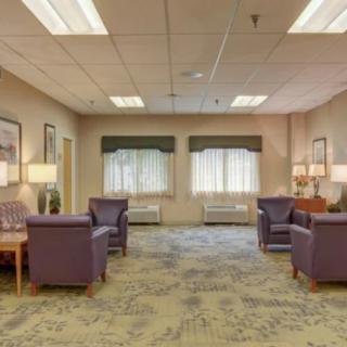 A spacious waiting room with comfortable seating and ample natural light.