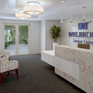 A welcoming reception area in a senior living facility with modern decor.