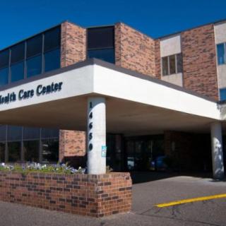 A health care center with a brick exterior and a prominent entrance.
