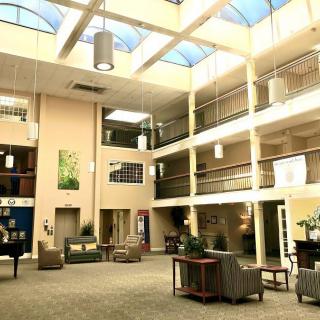 Spacious atrium lobby with skylights and comfortable seating.
