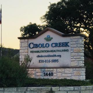 Cibolo Creek health services sign at sunset.
