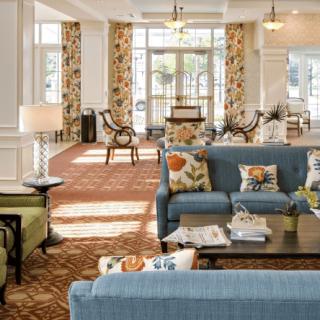 A spacious and elegantly decorated living room with comfortable seating and stylish furnishings.