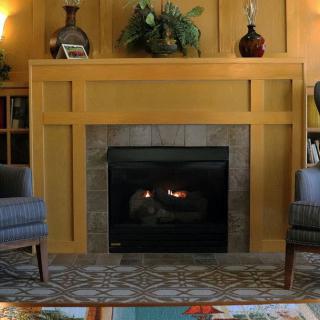 A cozy indoor fireplace surrounded by wooden paneling, with chairs and decorative items.