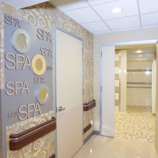 The interior hallway of a spa with relaxing decor.