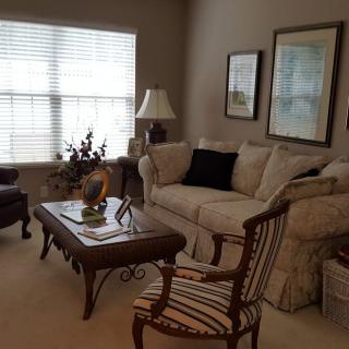A cozy living room with elegant furniture and decor.