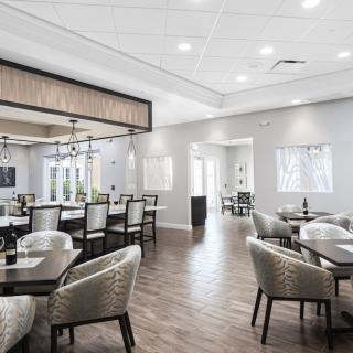A modern dining area with elegant furniture and stylish lighting.