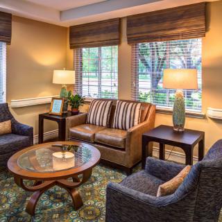 Cozy living room with a comfortable seating area and warm lighting.