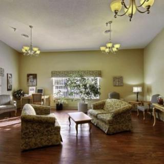 A cozy living room with comfortable seating and natural lighting.
