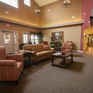A cozy lobby area with comfortable seating and warm lighting.