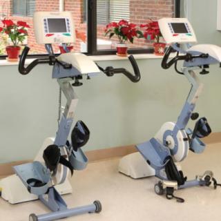 A pair of stationary exercise bikes in a fitness room.