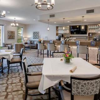 A well-appointed dining area with neatly arranged tables and elegant decor.