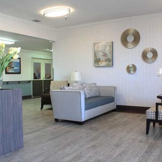 A modern lobby area with stylish furniture and decor elements.