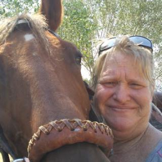 A joyful moment shared between a person and a horse.