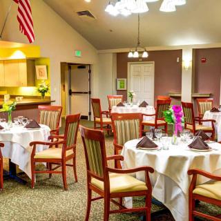 A well-arranged dining room with tables set for guests.