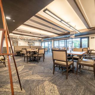Elegant restaurant interior with neatly arranged tables and chairs.