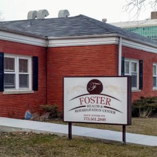 The Foster facility, featuring a red brick exterior and prominent signage.