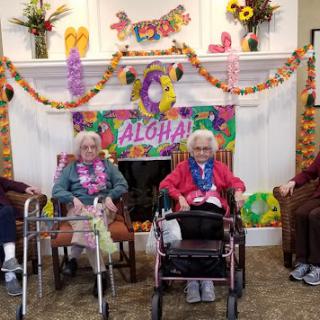 Residents enjoying a festive Aloha celebration together.