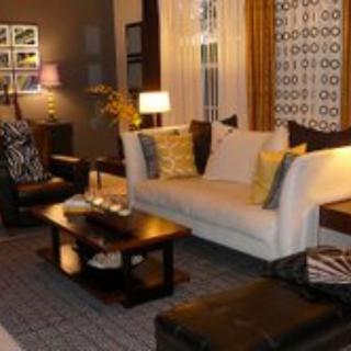 A cozy and modern living room with comfortable seating, stylish decor, and warm lighting.