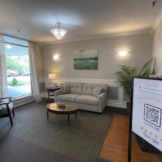 A cozy living room with a comfortable sofa, a coffee table, and a welcoming atmosphere.