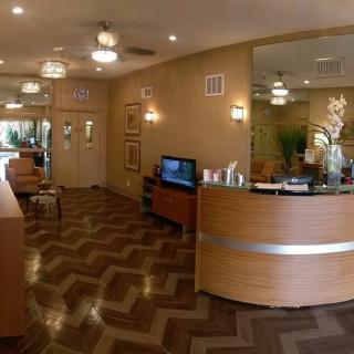 A modern reception area with wooden flooring and stylish decor.