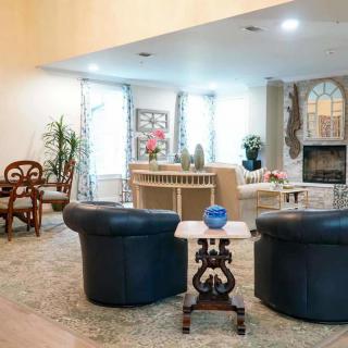 A cozy living room with comfortable seating and elegant decor.