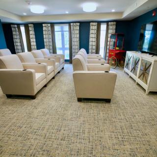 A luxurious home theater setup with comfortable seating and modern design.